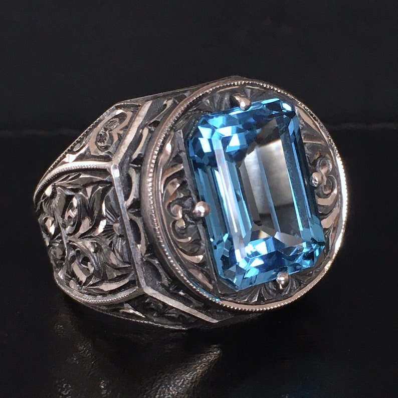 Zyan Gems | Exclusively Designed Ring with AAA Cut Octagonal Blue Topaz |  Sterling Silver Oxidized Hand-engraved Ring